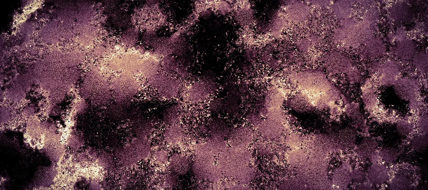 A blotchy closup of a surface, purple, redish, brown black